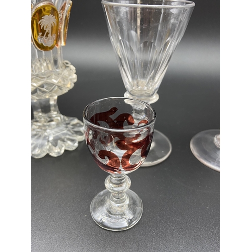 153 - A Lot of four antique and vintage cut glass drinking glasses. Includes Bohemian orange tinted and et... 