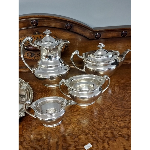 101 - An Antique Walker and Hall E.P Tea/ Coffee service together with an Engraved E.P Serving tray.