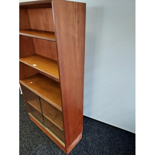 109 - A Mid century teak bookcase produced by Minty Oxford. [142x76.5x28cm]