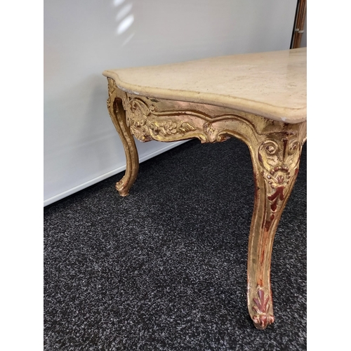 131 - A Regency gold leaf base and marble top lounge table. Designed with carved panel trims on cabriole s... 