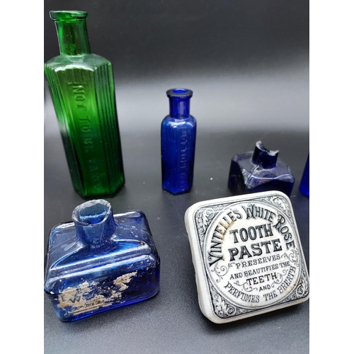 251 - A Collection of green and blue poison apothecary bottles, Blue ink pots, Vintelle's White Rose Tooth... 