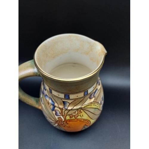 316 - Charlotte Rhead Bursley Ware Autumn pattern water jug. [19cm in height]