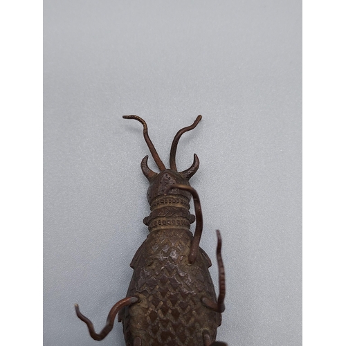 52J - A 19th century [possibly earlier] Far Eastern Bronze sculpture of a beetle. [2.5x6.5x2cm]