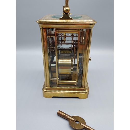 64J - A Heavy Antique brass and bevel glass carriage clock. Comes with a key. [Runs for a short while then... 