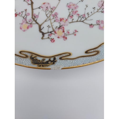 110 - A Heavy Japanese hand painted bird and cherry blossom design plate. Eight Character signature to the... 