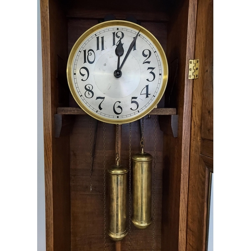 58 - An oak cased Grandfather clock, with hand carved foliage design to the upper section, silver and gol... 