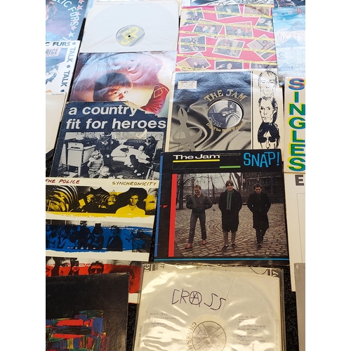 180 - A Collection of mixed records to include Sex Pistols, Simple Minds, The Motors, Fuzzbox, The Jam, Sq... 