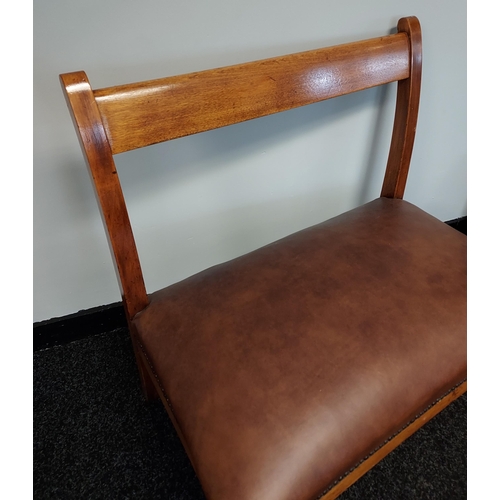 186 - A 19th century window two seat loving chair. Reupholstered in brown leather [80x76x30cm]