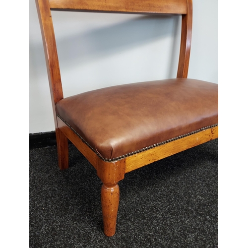 186 - A 19th century window two seat loving chair. Reupholstered in brown leather [80x76x30cm]