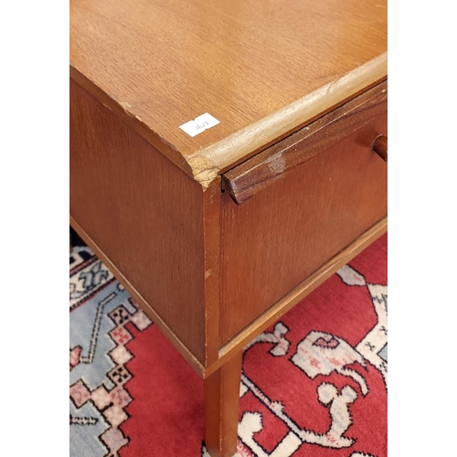 202 - A Mid century teak and faux green leather telephone table. [56x98x50cm]