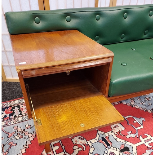 202 - A Mid century teak and faux green leather telephone table. [56x98x50cm]