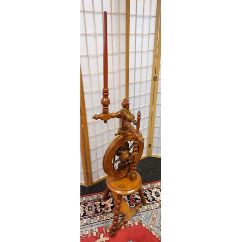 206 - A Victorian arts and crafts bobble leg spinning wheel. [135cm in height]