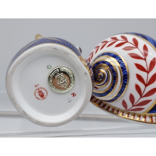 222 - Two Royal Crown Derby figures, Kola and snail.