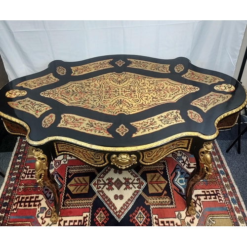 228 - A Reproduction Antique style French Boulle Work desk. [80x145x86cm]