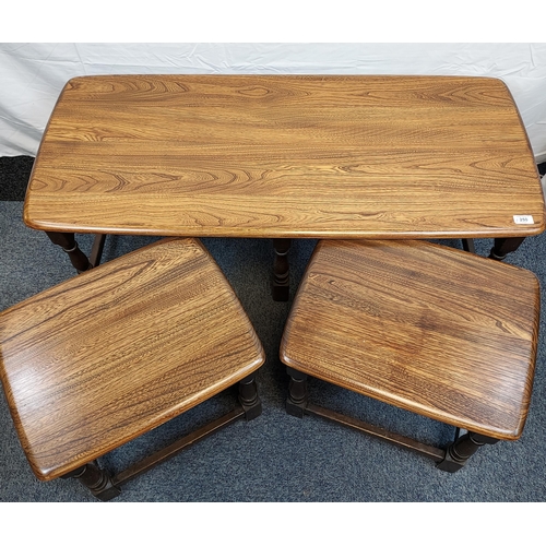 250 - A Vintage Elm wood Ercol coffee table with two matching pull out tables.