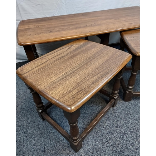 250 - A Vintage Elm wood Ercol coffee table with two matching pull out tables.