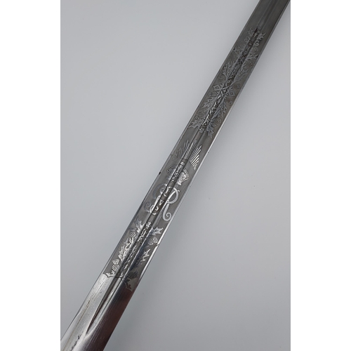 270 - A Military King George V Cavalry sword with scabbard. Produced by Henry Wilkinson Pall Mall London. ... 