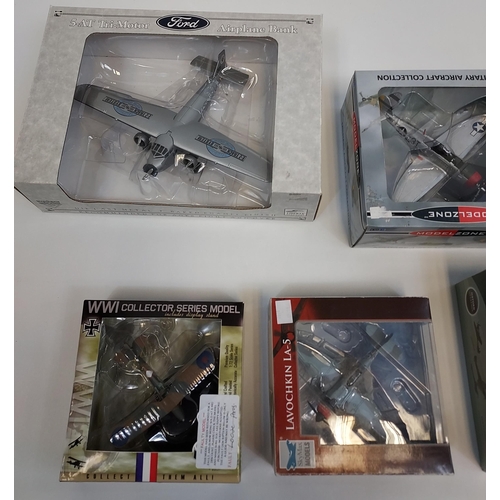 310 - A Collection of boxed die cast model planes