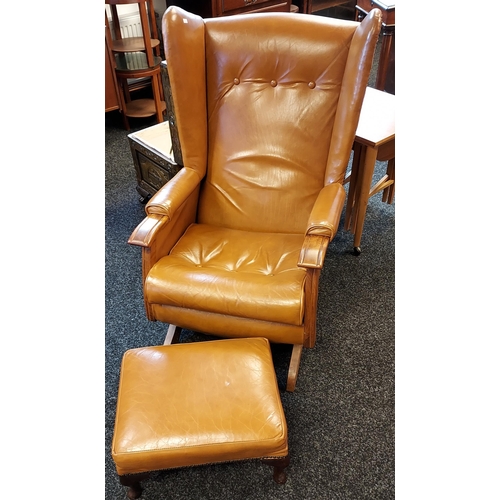 357 - A Vintage/ mid century brown mustard leather rocking arm chair with matching foot stool