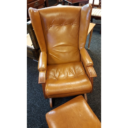 357 - A Vintage/ mid century brown mustard leather rocking arm chair with matching foot stool