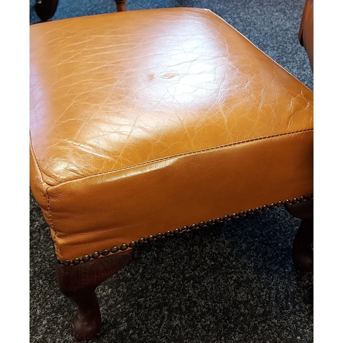 357 - A Vintage/ mid century brown mustard leather rocking arm chair with matching foot stool