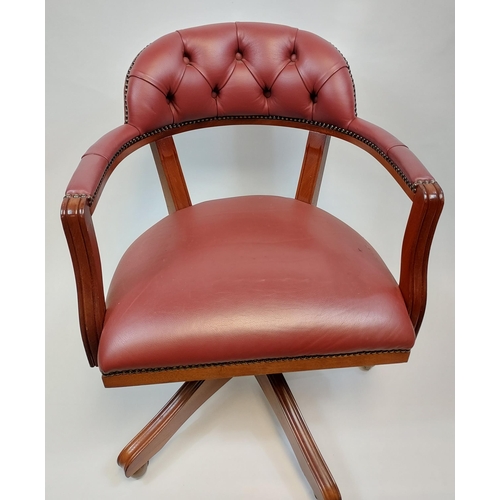 360 - A reproduction chesterfield style captains chair.