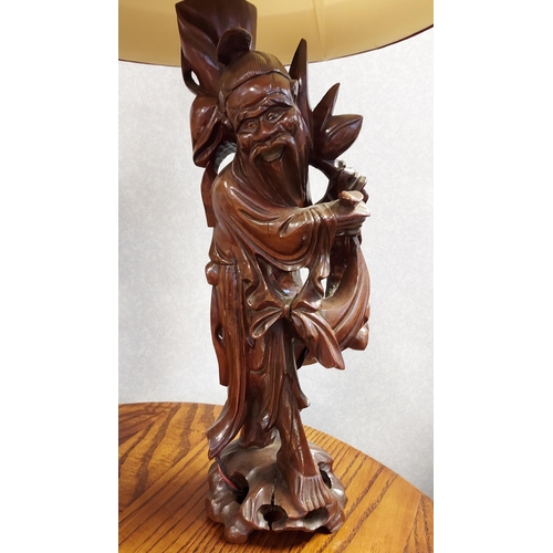 370 - A Japanese hand carved wooden figure table lamp together with an African carved elephant table lamp