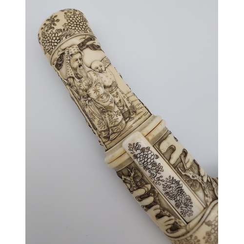 390 - A 19th/ early 20th century highly decorative Japanese Tanto. Carved from ivory. Saya has a smaller b... 