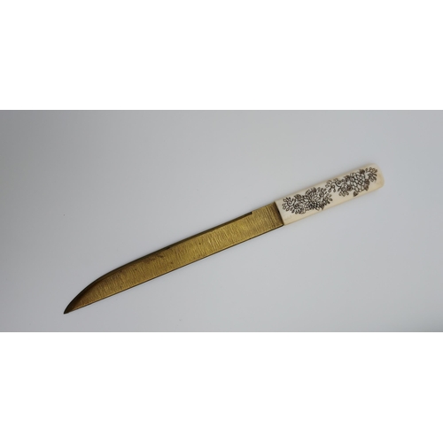 390 - A 19th/ early 20th century highly decorative Japanese Tanto. Carved from ivory. Saya has a smaller b... 