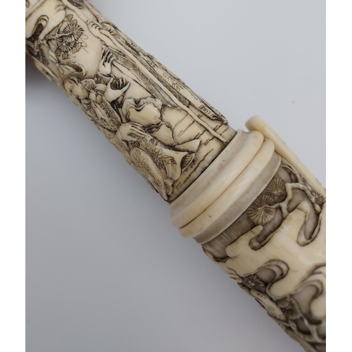 390 - A 19th/ early 20th century highly decorative Japanese Tanto. Carved from ivory. Saya has a smaller b... 