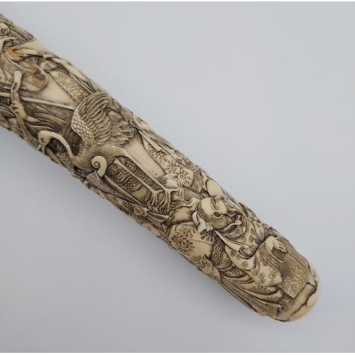 390 - A 19th/ early 20th century highly decorative Japanese Tanto. Carved from ivory. Saya has a smaller b... 