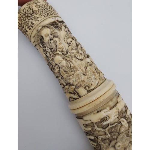 390 - A 19th/ early 20th century highly decorative Japanese Tanto. Carved from ivory. Saya has a smaller b... 