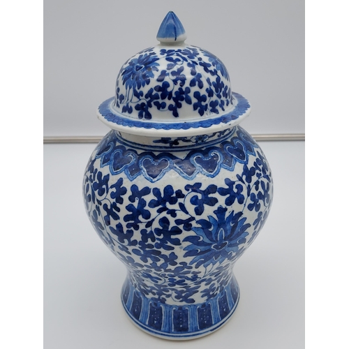 399 - A Japanese/ Chinese blue and white pattern lidded preserve pot. [27cm in height] [As found to rim]