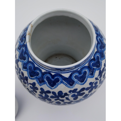 399 - A Japanese/ Chinese blue and white pattern lidded preserve pot. [27cm in height] [As found to rim]