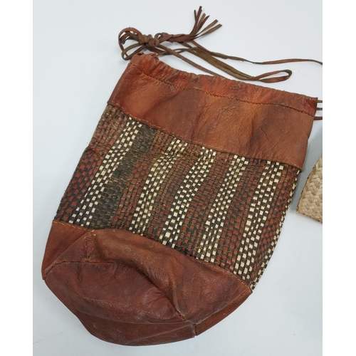 418 - Tribal leather, weaved carry bag and swat/ brush?