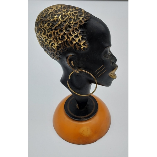 419 - Possible Karl Hagenauer 
Bronze head sculpture sat upon a butterscotch amber base.