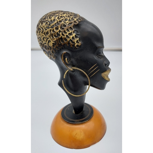 419 - Possible Karl Hagenauer 
Bronze head sculpture sat upon a butterscotch amber base.