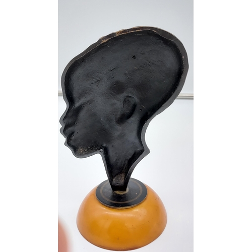 419 - Possible Karl Hagenauer 
Bronze head sculpture sat upon a butterscotch amber base.