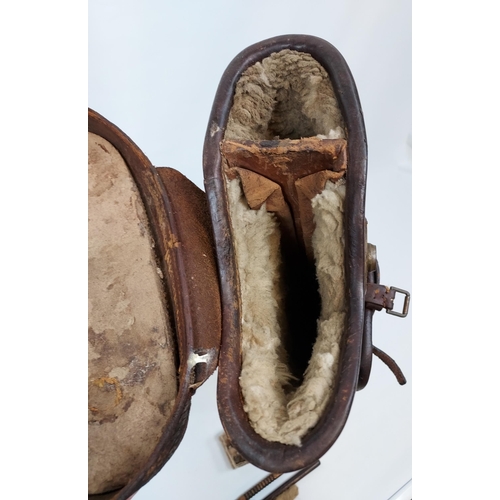 439 - Antique sheepskin lined, 'Leg O Mutton' gun case along with various gun cleaning rods.