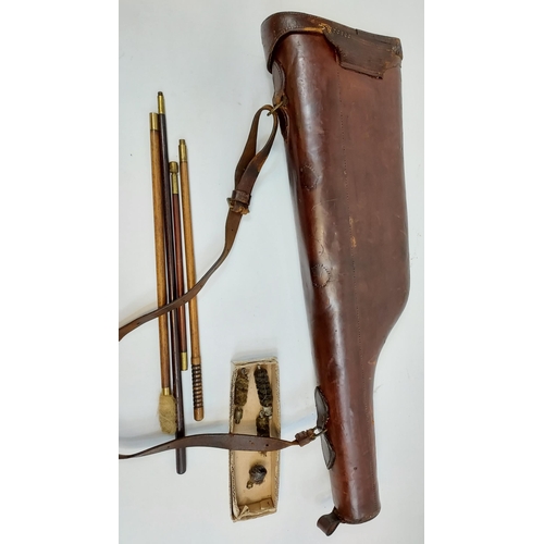 439 - Antique sheepskin lined, 'Leg O Mutton' gun case along with various gun cleaning rods.