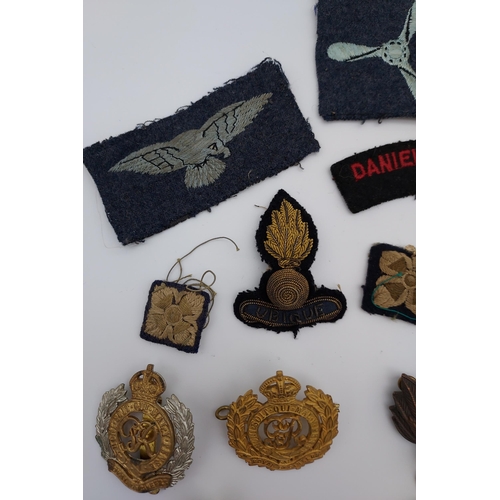 441 - A Selection of various miliary cap and collar badges, patches, British Columbia Regiment belt buckle... 