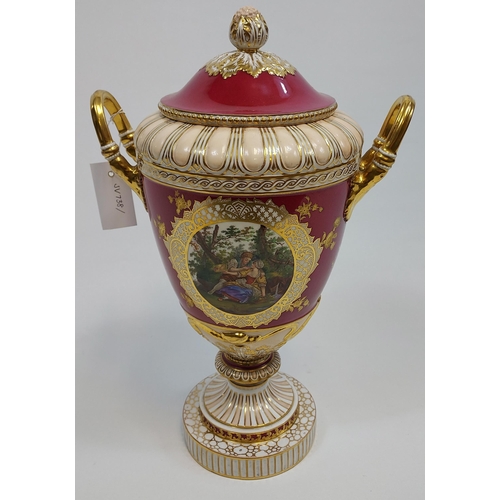 474 - A Large 19th century European highly decorative two handle urn with lid. Detailed with two panels de... 