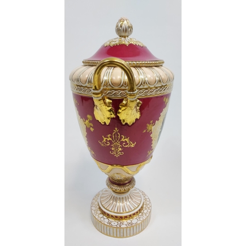 474 - A Large 19th century European highly decorative two handle urn with lid. Detailed with two panels de... 