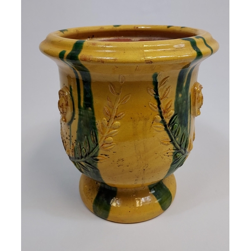 475 - A Large antique Majolica plant pot. Designed in a yellow and green glaze. [31cm in height]