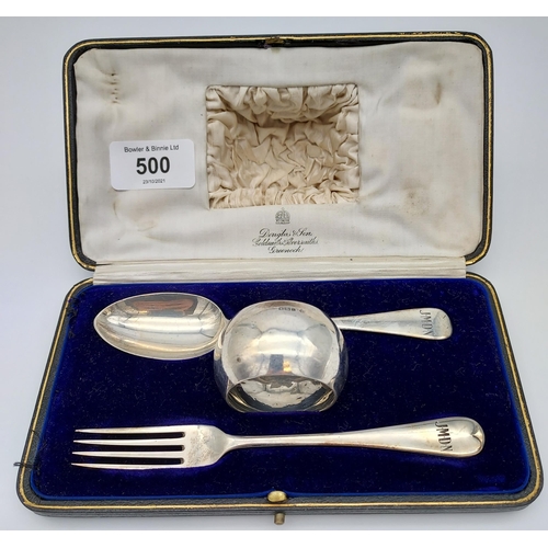 500 - A Boxed London silver three piece Christening set. Fork, spoon and napkin ring.