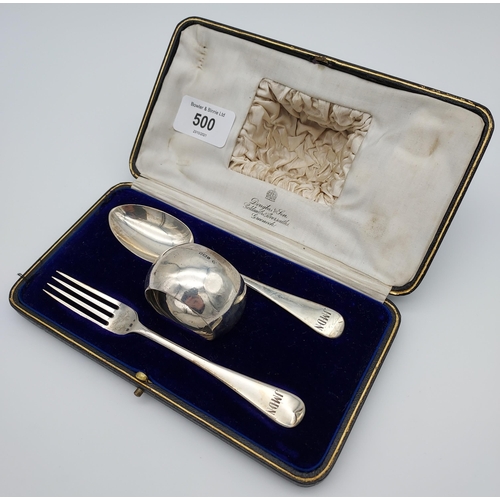 500 - A Boxed London silver three piece Christening set. Fork, spoon and napkin ring.