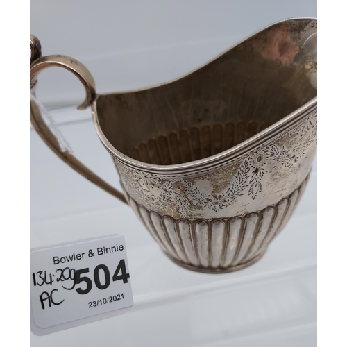 504 - A Victorian ornate Sheffield silver cream jug produced by Mappin & Webb. [134.20grams]