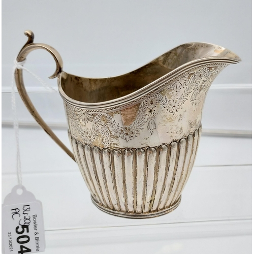 504 - A Victorian ornate Sheffield silver cream jug produced by Mappin & Webb. [134.20grams]