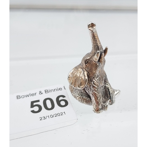 506 - A silver figure of a trumpeting elephant. [3.4cm in height]