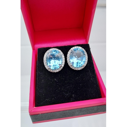 510 - A pair of silver blue topaz and CZ earrings 15MM in length]